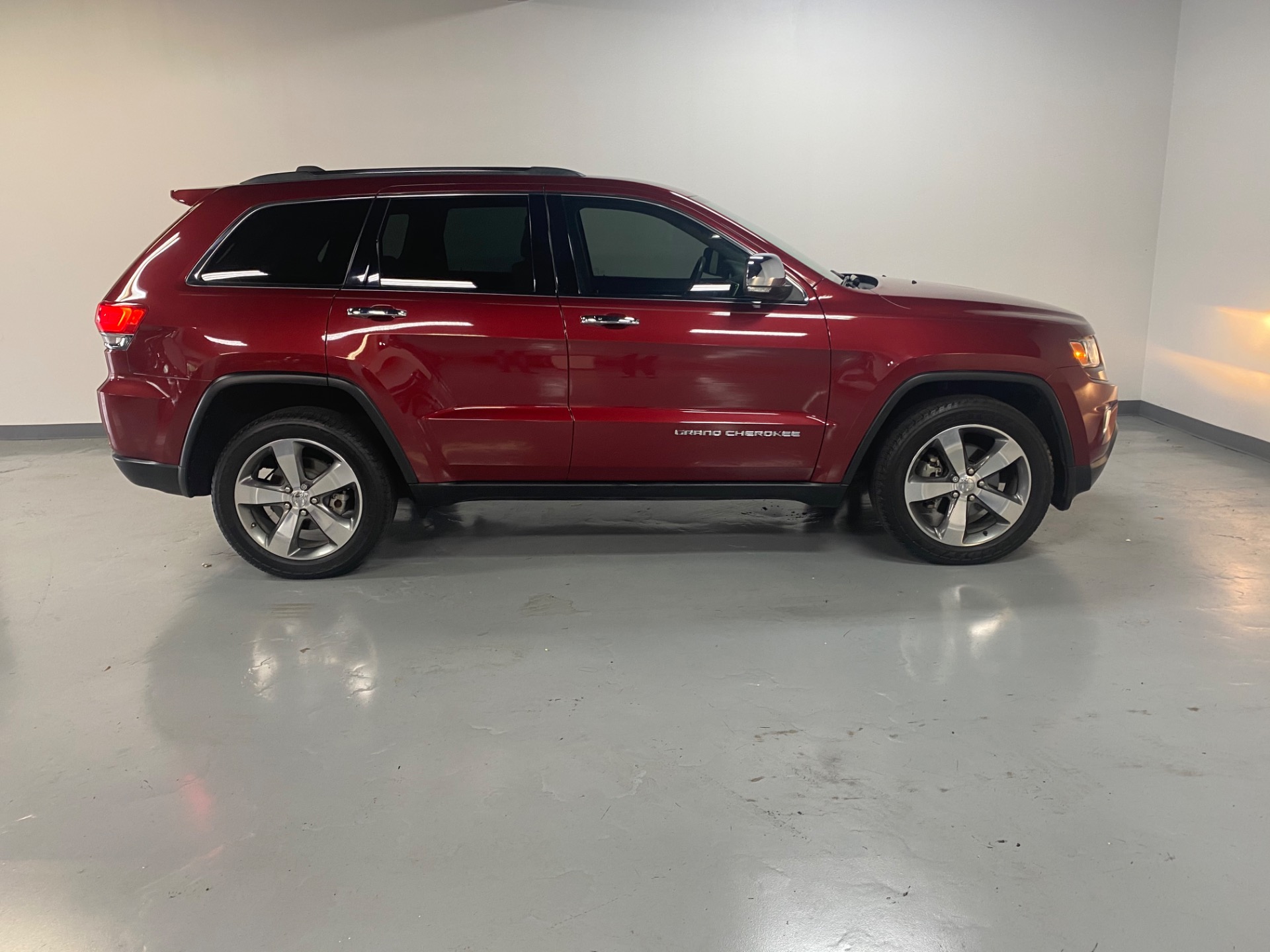 Used 2014 Deep Cherry Red Crystal Pearl Coat Jeep Grand