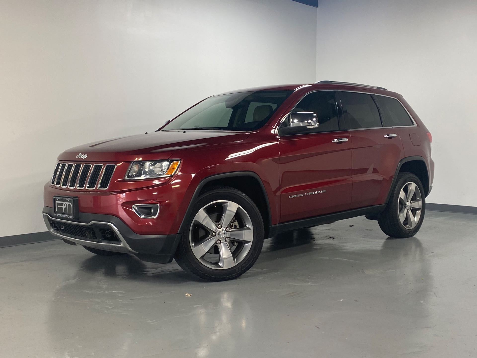 Used 2014 Deep Cherry Red Crystal Pearl Coat Jeep Grand Cherokee